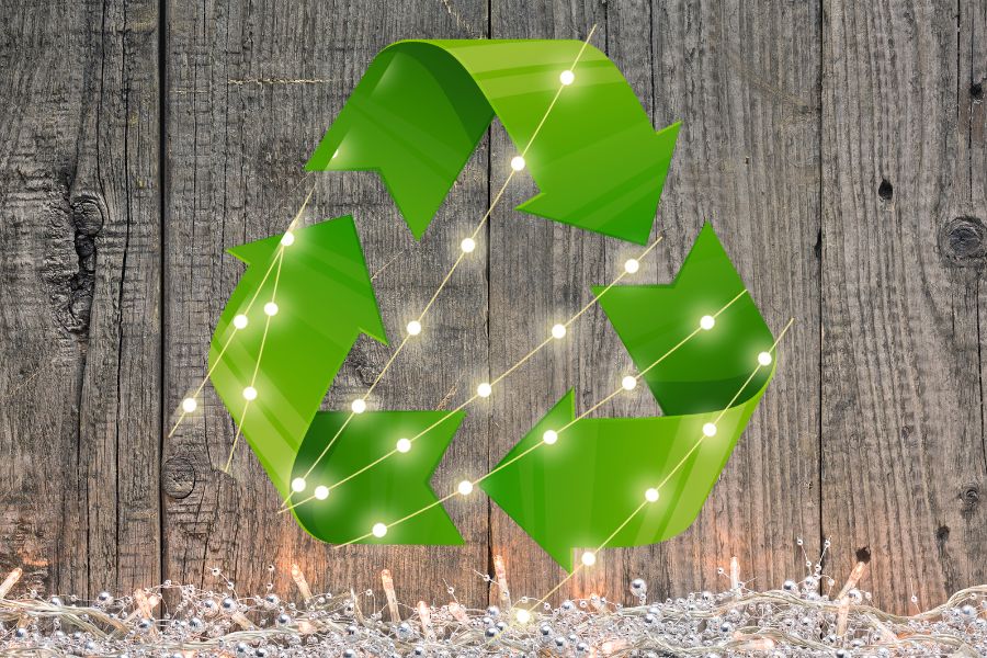 holiday lights with green recycle symbol